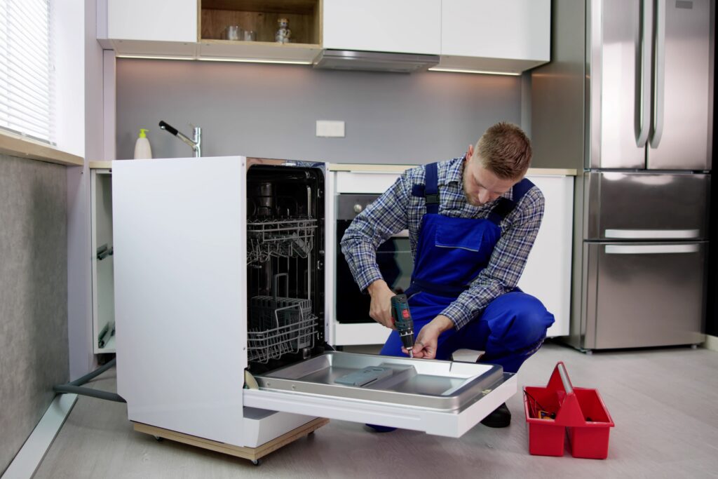 metal-roof professional repairman fixing dishwasher modern kitchen
