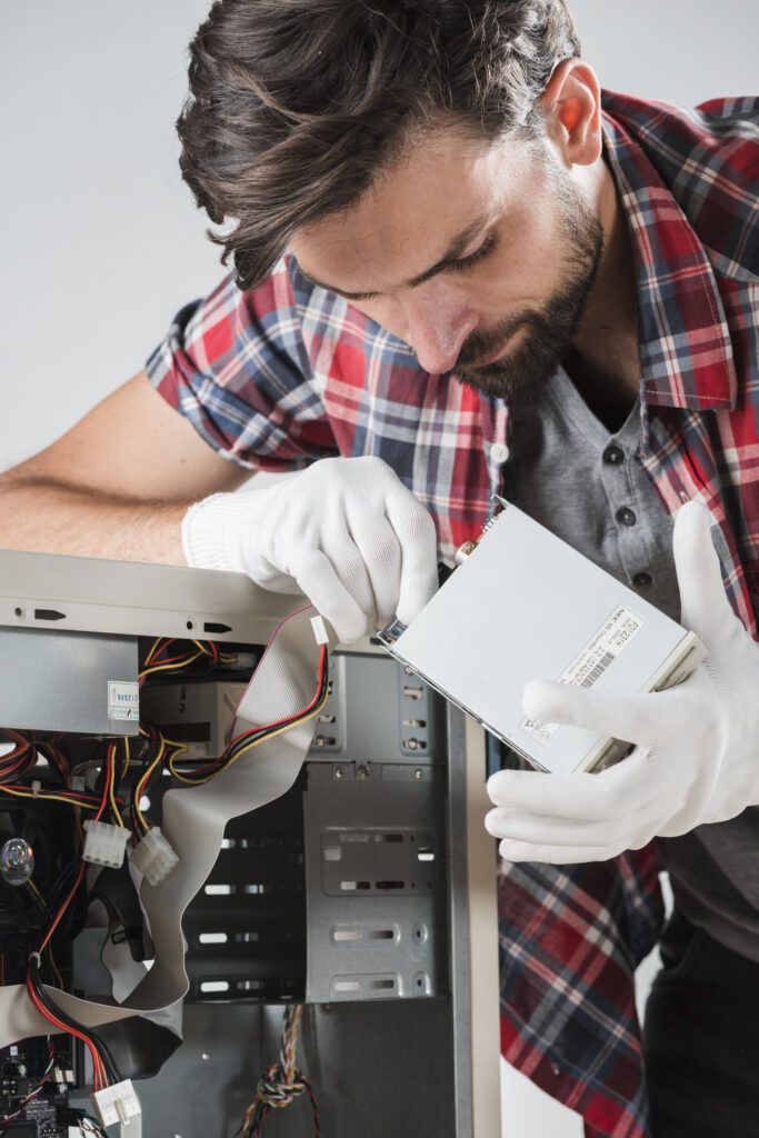 services-1 technician inserting sata data cable hard disk drive